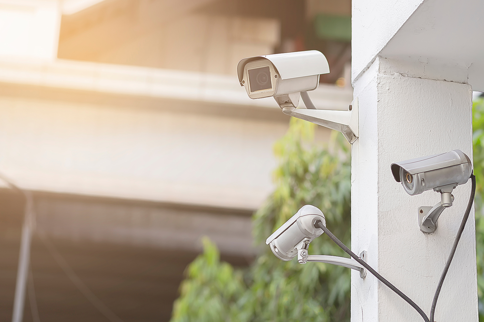 Three security cameras on the exterior of a building